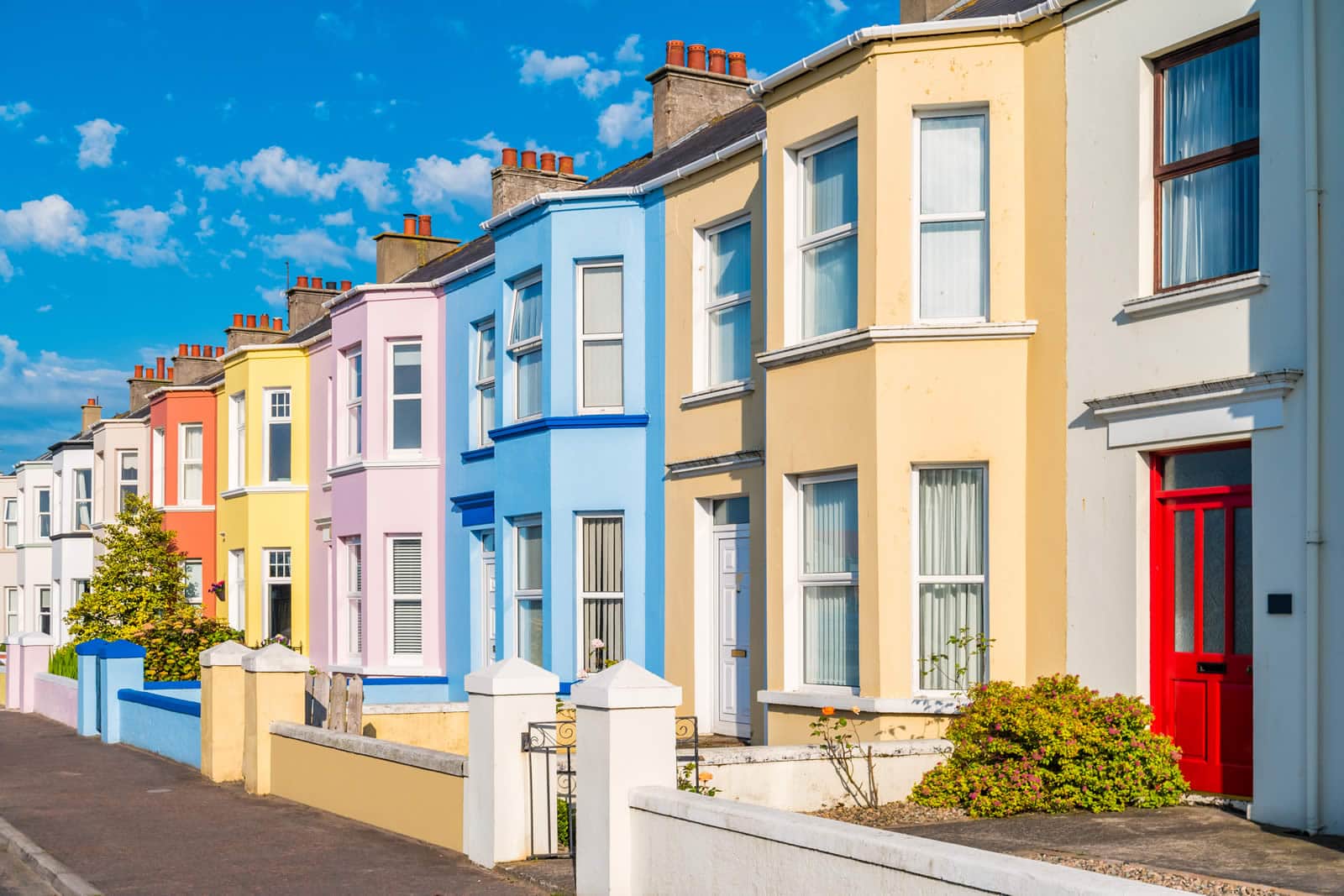 Colourful terraced townhouse properties on a sunny day